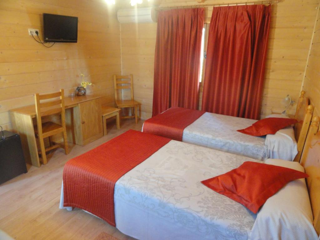 Postel nebo postele na pokoji v ubytování Motel San Isidro