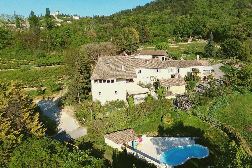 an aerial view of a house with a swimming pool at Les Vergers de la Bouligaire Gîtes in Mirmande