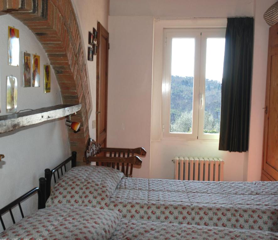 Postel nebo postele na pokoji v ubytování Agriturismo Olmi Grossi