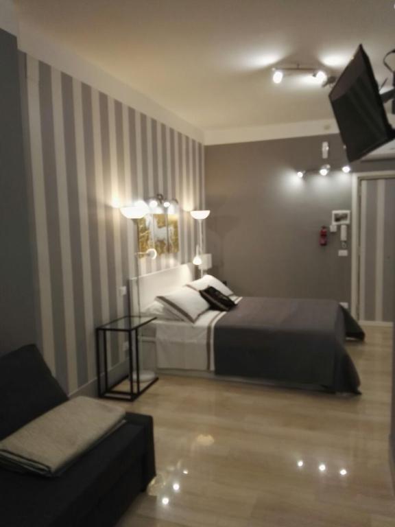 Postel nebo postele na pokoji v ubytování B&B Pescara Centro Luxury Suite