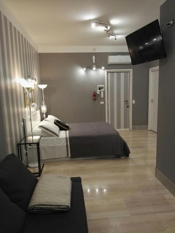 Postel nebo postele na pokoji v ubytování B&B Pescara Centro Luxury Suite