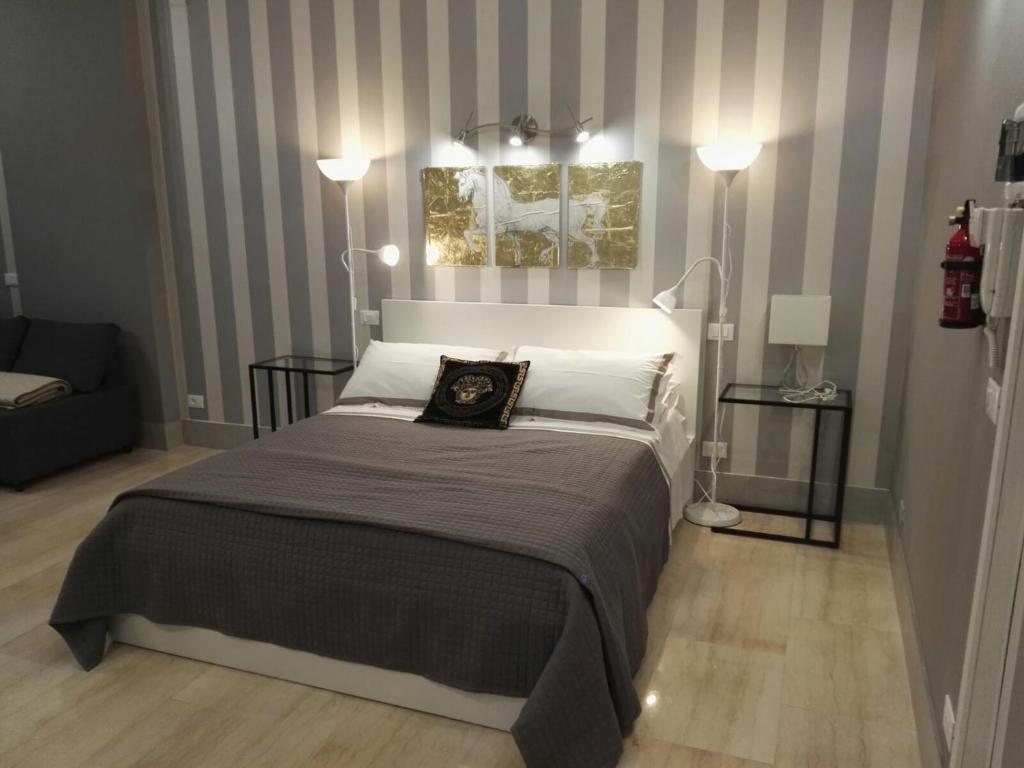 Postel nebo postele na pokoji v ubytování B&B Pescara Centro Luxury Suite