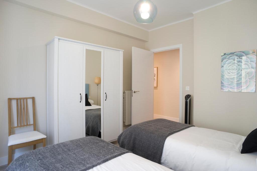 Posteľ alebo postele v izbe v ubytovaní San Diego - Iberorent Apartments