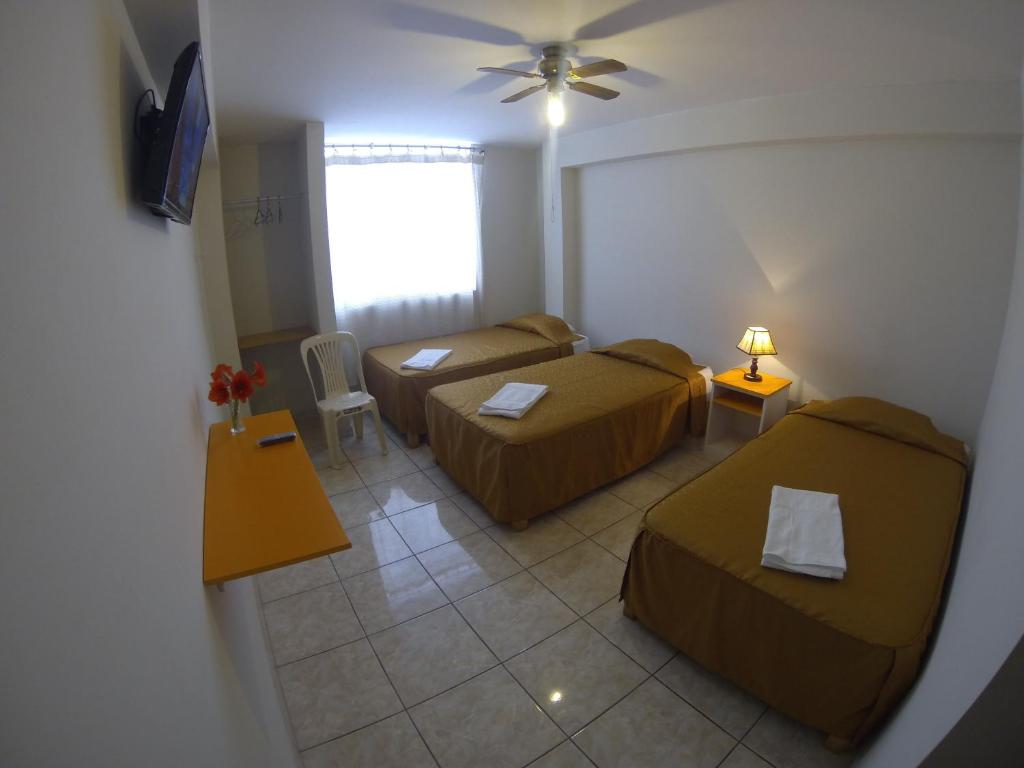 Кровать или кровати в номере Hospedaje el Telar