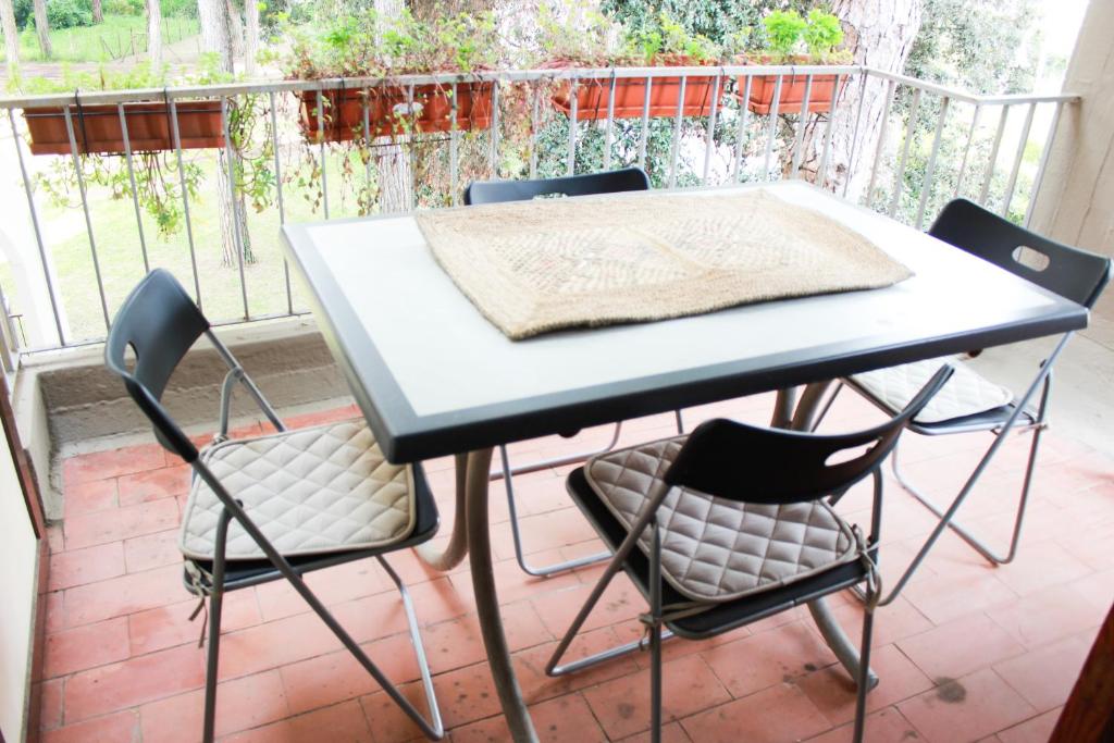 a table and chairs sitting on a patio at Lagomare Puccini in Torre del Lago Puccini