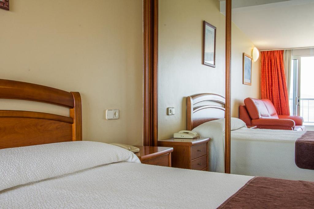 Postel nebo postele na pokoji v ubytování Hotel Restaurante Loureiro