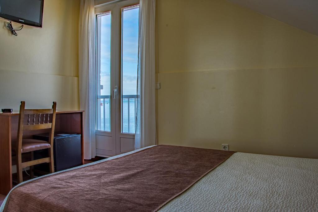 Postel nebo postele na pokoji v ubytování Hotel Restaurante Loureiro