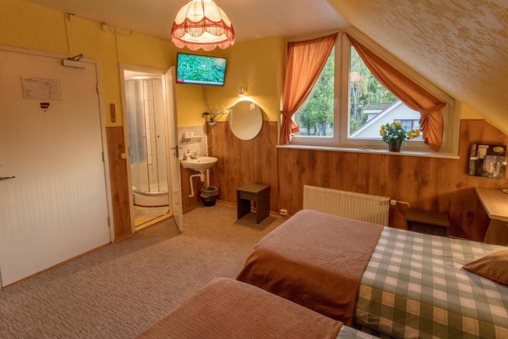Postel nebo postele na pokoji v ubytování Endla Hotell