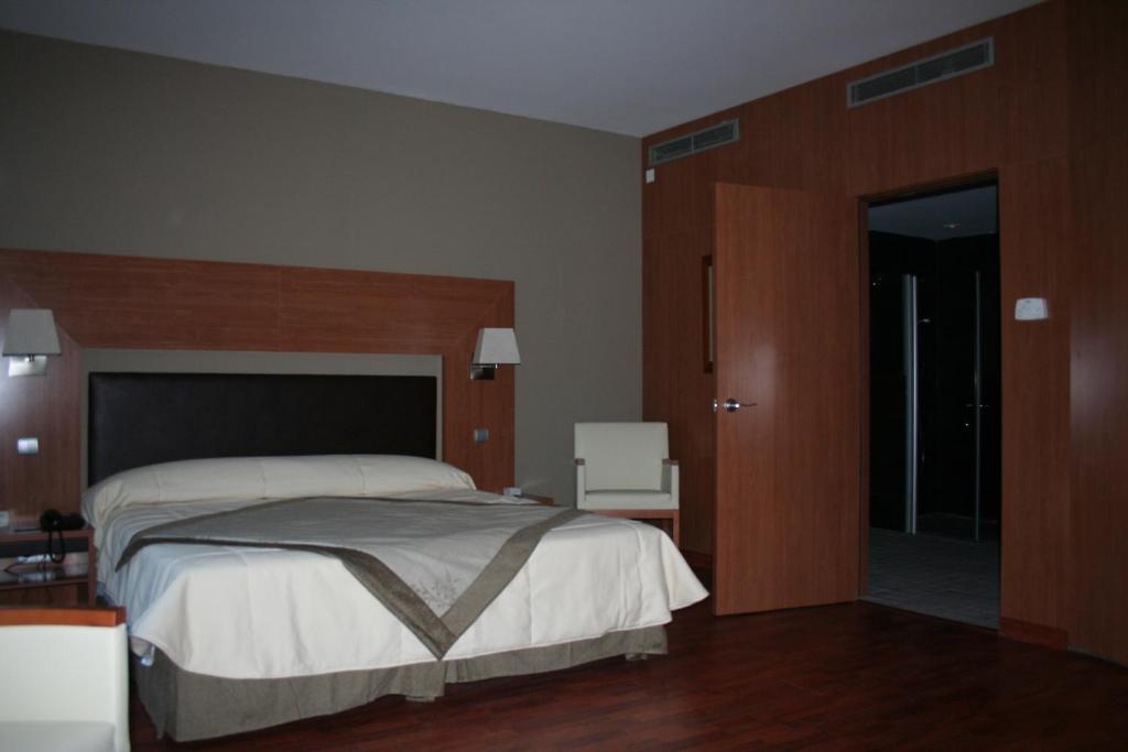 Postel nebo postele na pokoji v ubytování Alti Hôtel