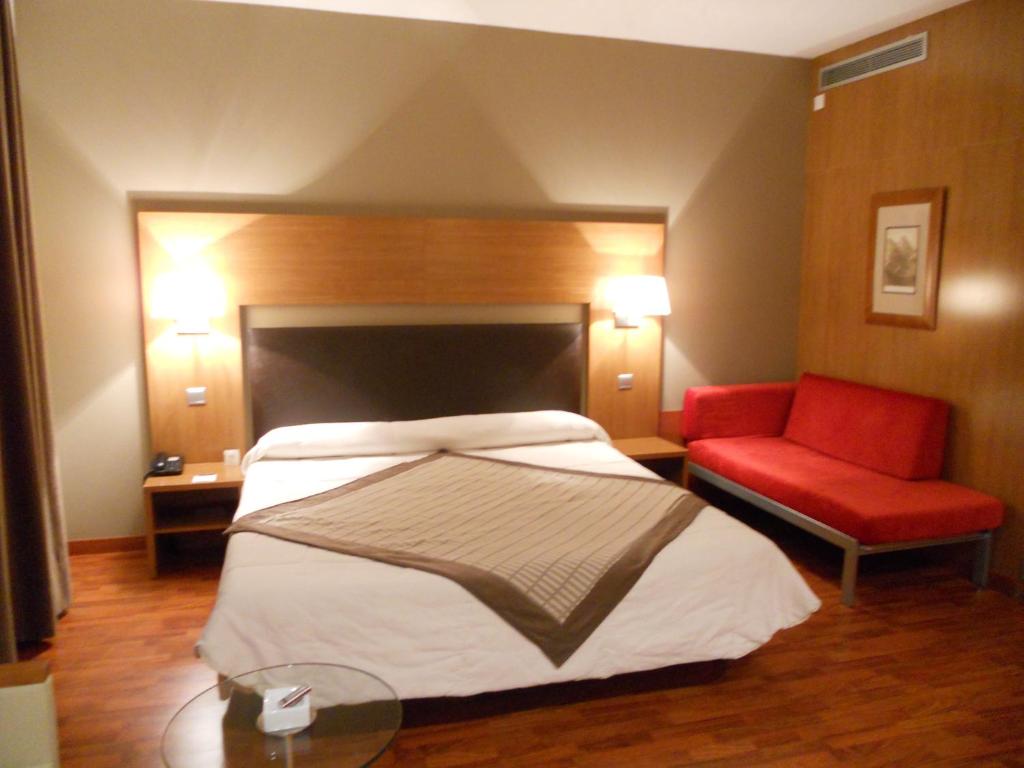 Postel nebo postele na pokoji v ubytování Alti Hôtel