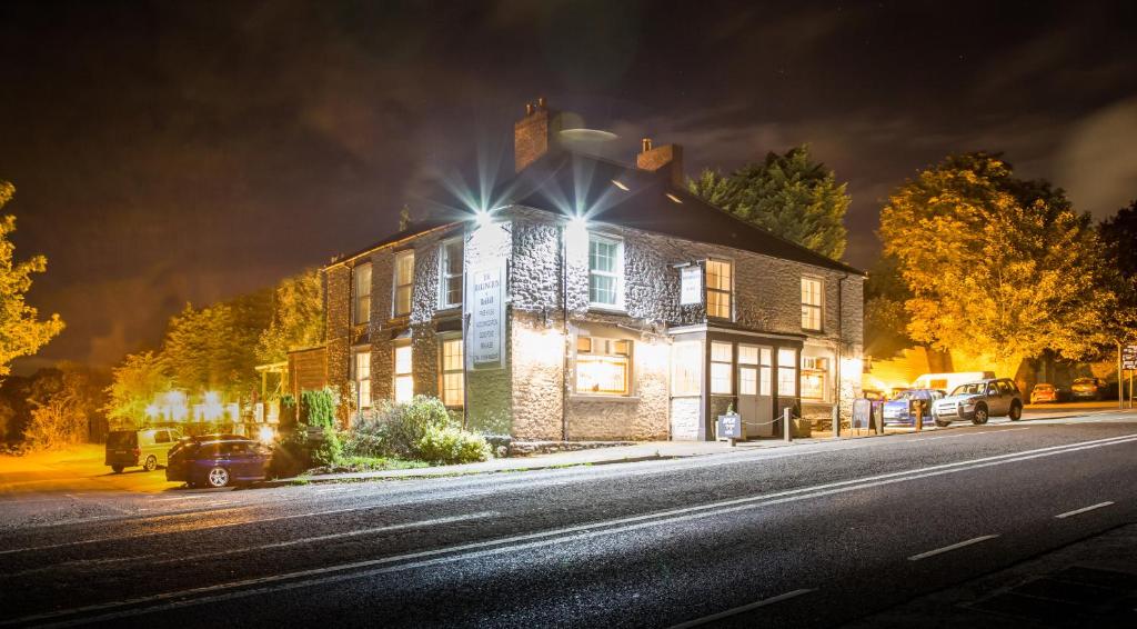 a house with lights on the side of a street at Darlington Arms in Redhill