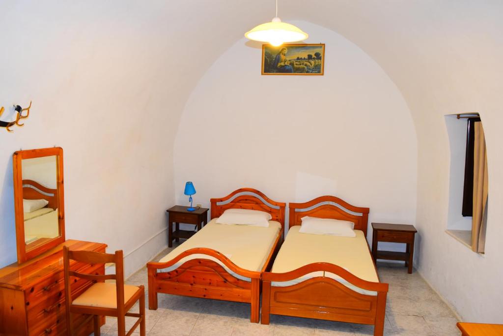 Postel nebo postele na pokoji v ubytování Stathis
