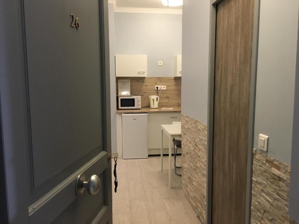 Kuchyň nebo kuchyňský kout v ubytování Apartments Monaco
