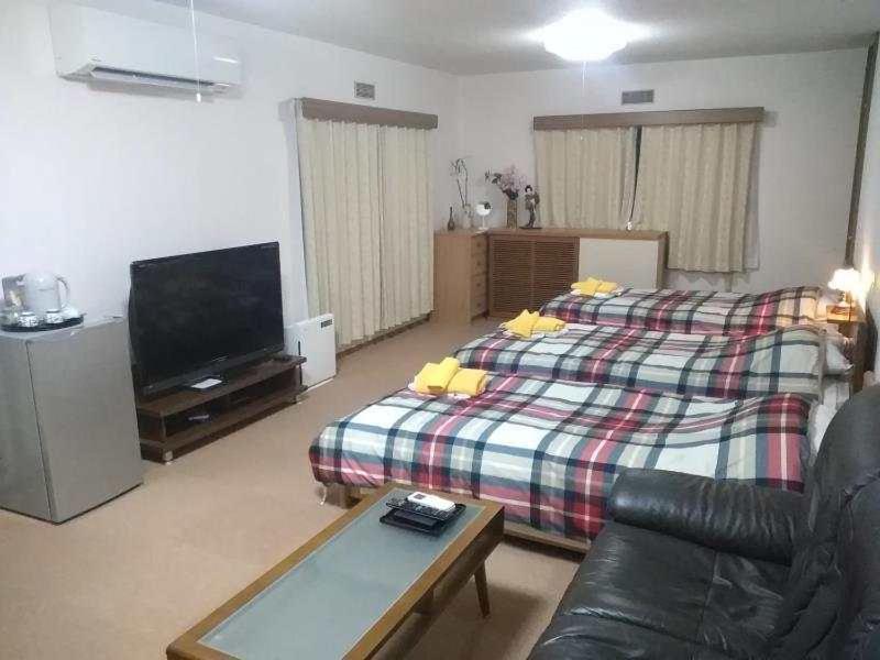 TV a/nebo společenská místnost v ubytování Hotel Otani