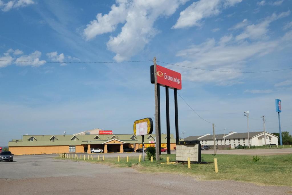a cocacola gas sign in front of a store at Econo Lodge Elk City in Elk City