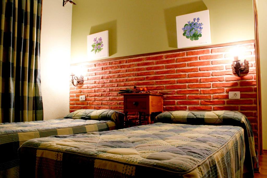 Postel nebo postele na pokoji v ubytování Hostatgeria Sant Jaume