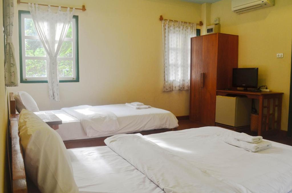 Postel nebo postele na pokoji v ubytování Pai Flora Resort