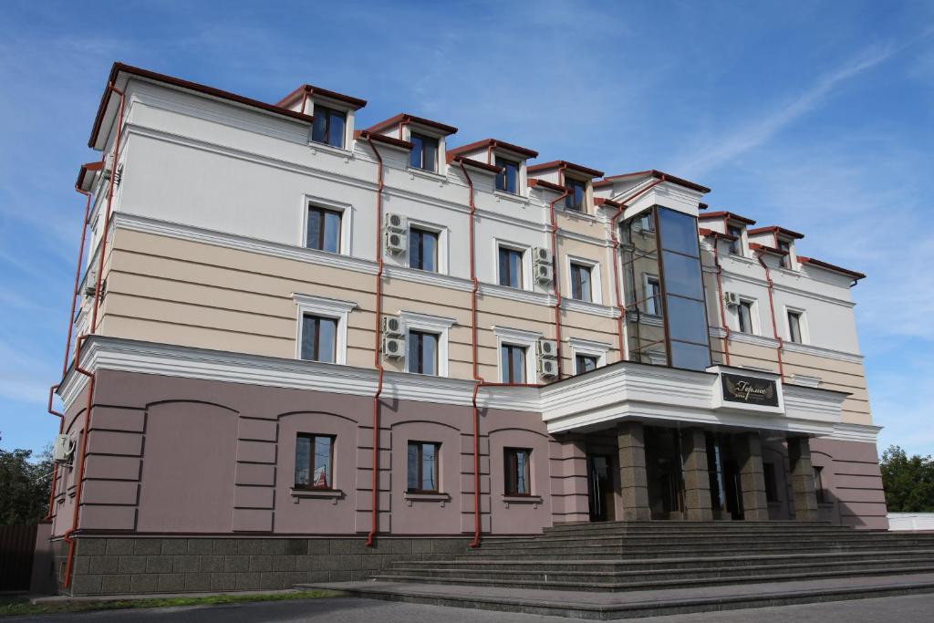 a large building with steps in front of it at Hermes in Zhytomyr