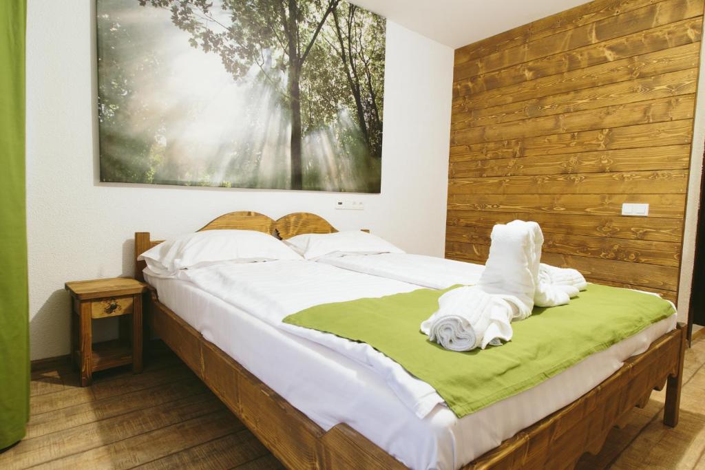 Una cama o camas en una habitación de Hotel Superski
