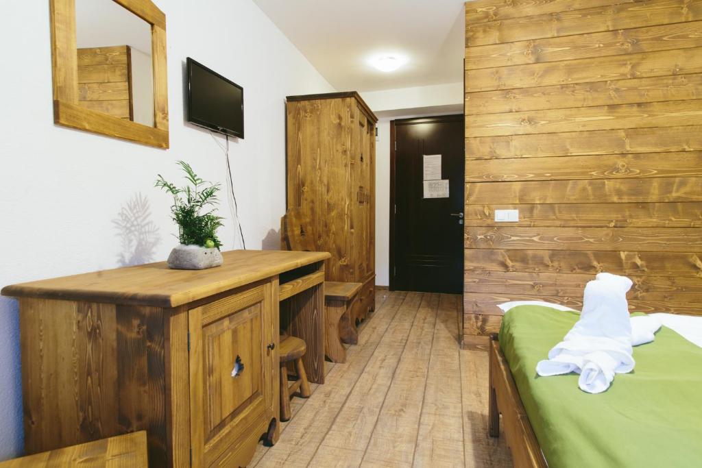 Una cama o camas en una habitación de Hotel Superski