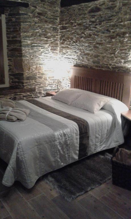 Postel nebo postele na pokoji v ubytování Apartamentos El Sualleiro