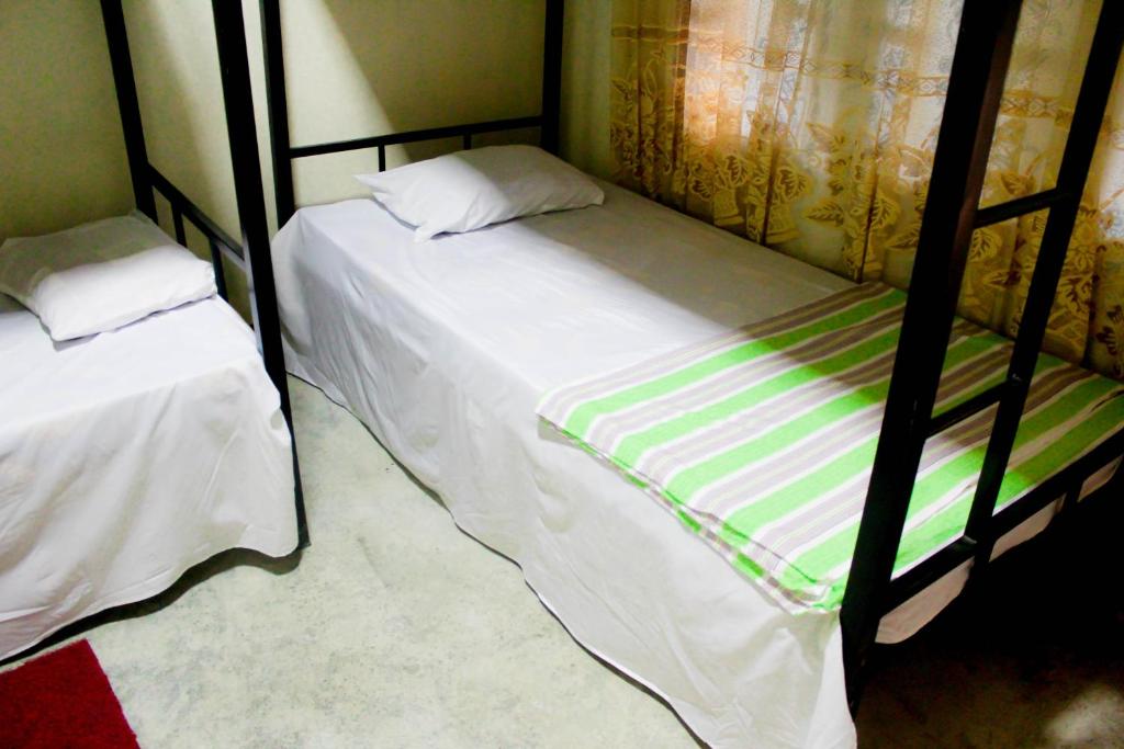 Postel nebo postele na pokoji v ubytování J hostel kandy