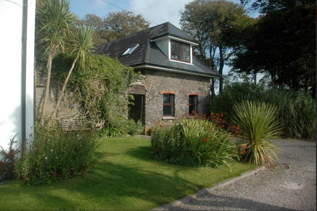 a small house with a large window at Redington House SelfCatering accommodation in Cobh