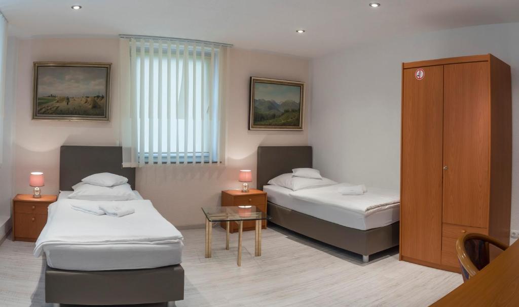 Postel nebo postele na pokoji v ubytování Pension Donau