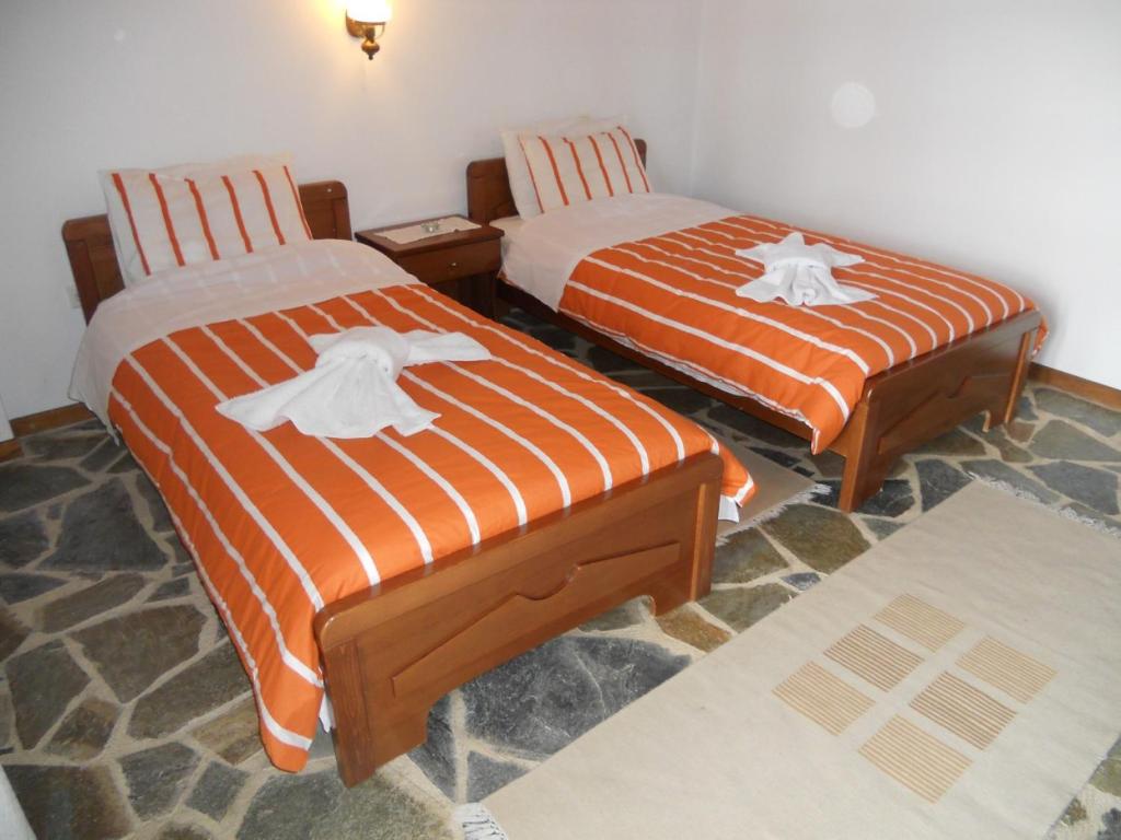 Postel nebo postele na pokoji v ubytování Guesthouse Ariadni