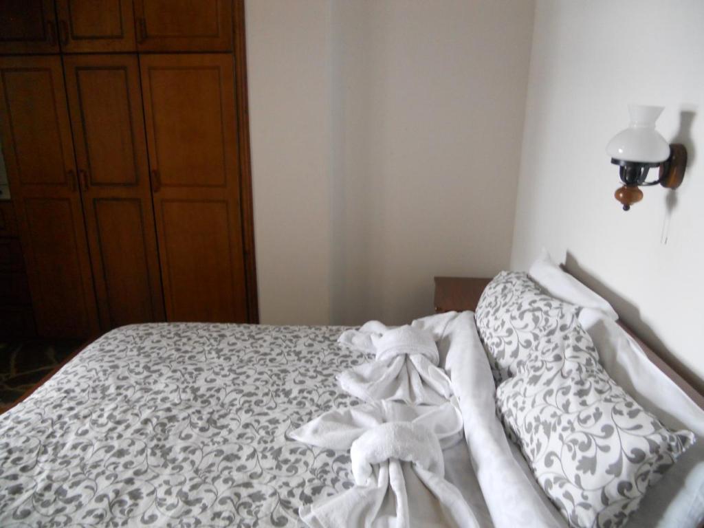 Postel nebo postele na pokoji v ubytování Guesthouse Ariadni