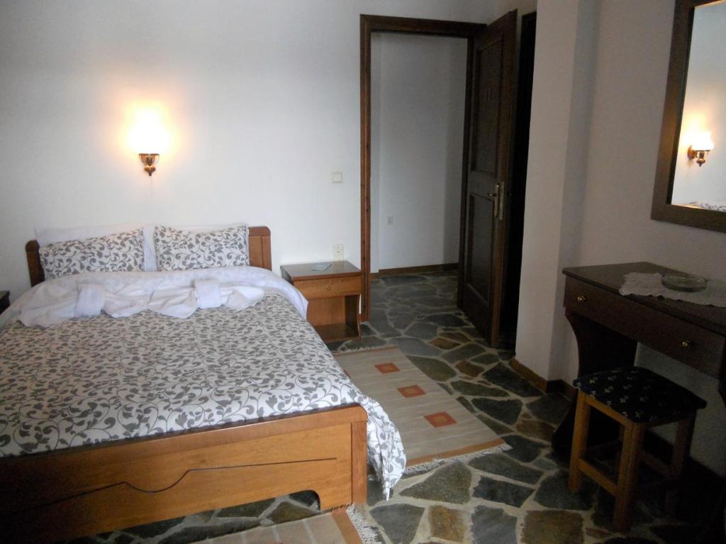 Postel nebo postele na pokoji v ubytování Guesthouse Ariadni