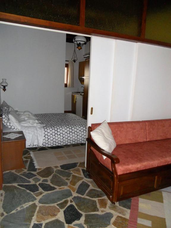 Postel nebo postele na pokoji v ubytování Guesthouse Ariadni