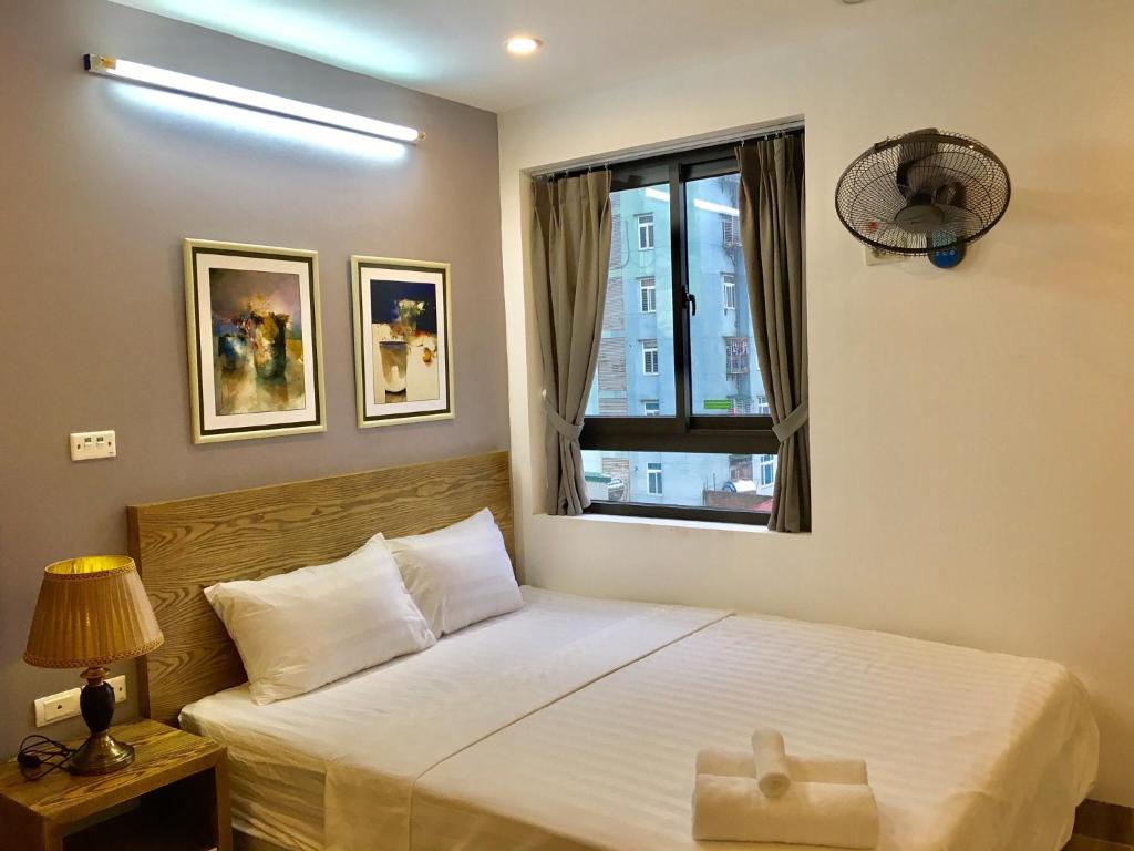 Postel nebo postele na pokoji v ubytování V House 5 Serviced Apartment