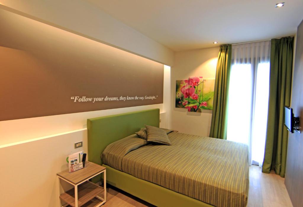Postel nebo postele na pokoji v ubytování Hotel Ideal