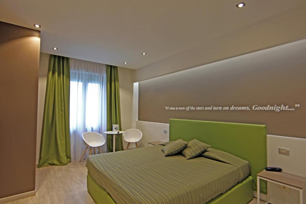 Postel nebo postele na pokoji v ubytování Hotel Ideal