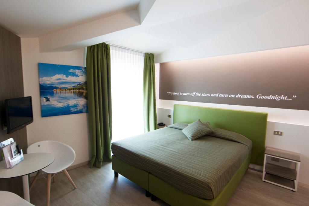 Postel nebo postele na pokoji v ubytování Hotel Ideal