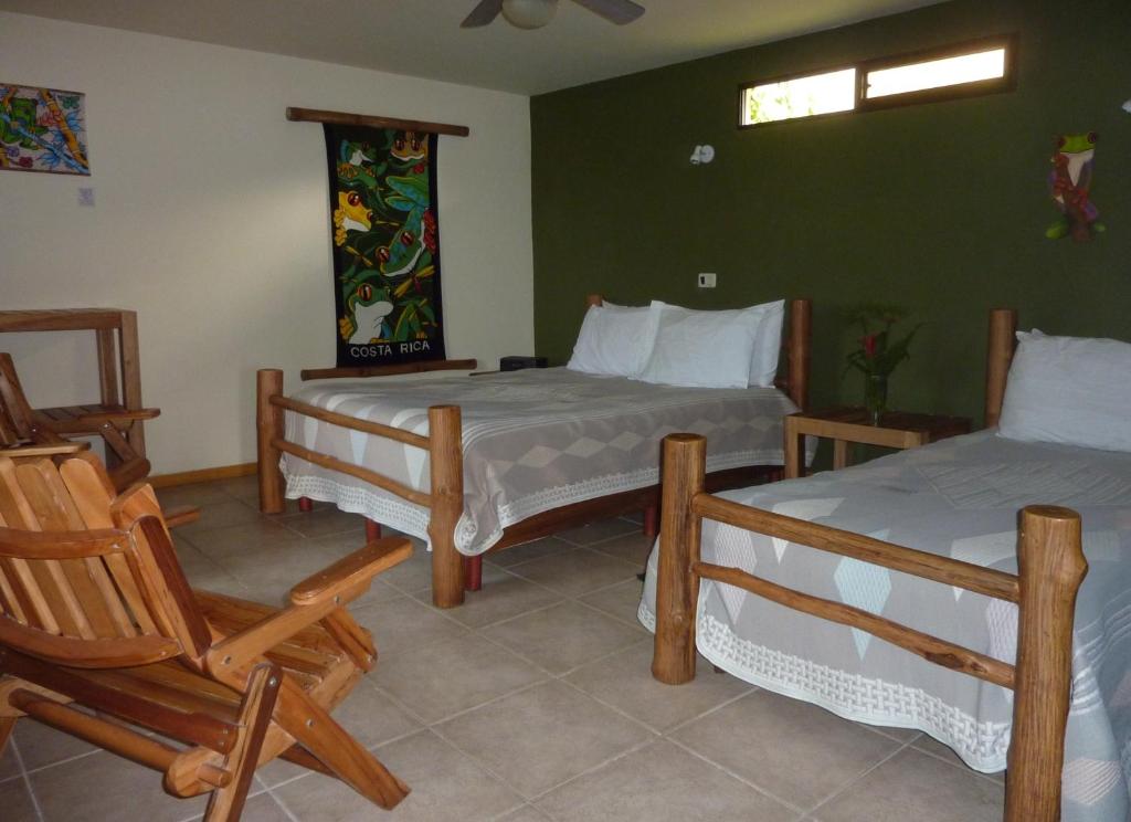 Postel nebo postele na pokoji v ubytování Pura Vida Hotel