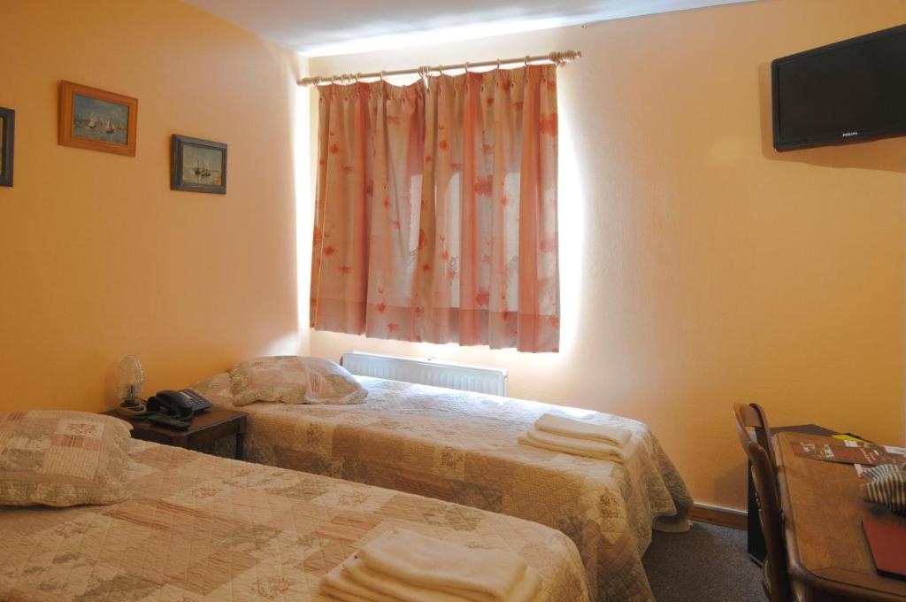 Postel nebo postele na pokoji v ubytování Hotel Restaurant La Ferme de Grambais