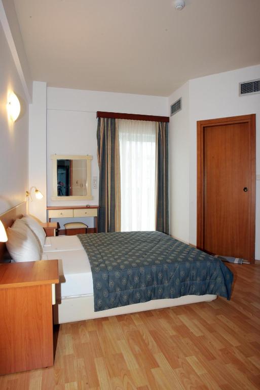 Postel nebo postele na pokoji v ubytování Hotel Filoxenia Beach