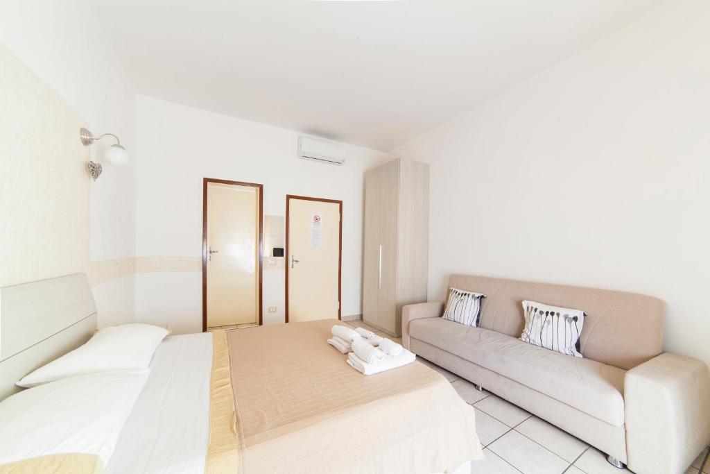 A bed or beds in a room at Affittacamere San Jacopino