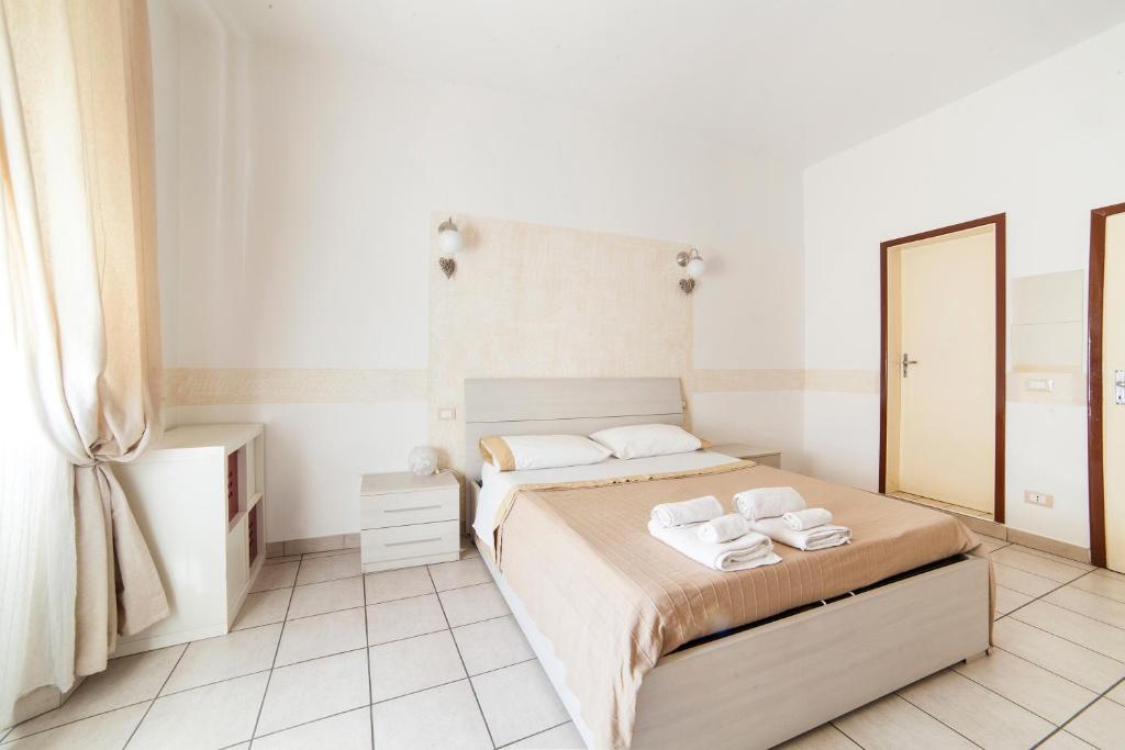 A bed or beds in a room at Affittacamere San Jacopino