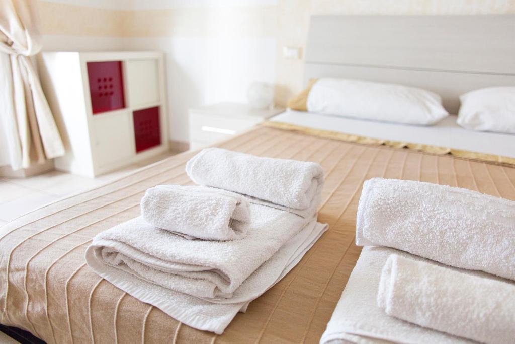 A bed or beds in a room at Affittacamere San Jacopino