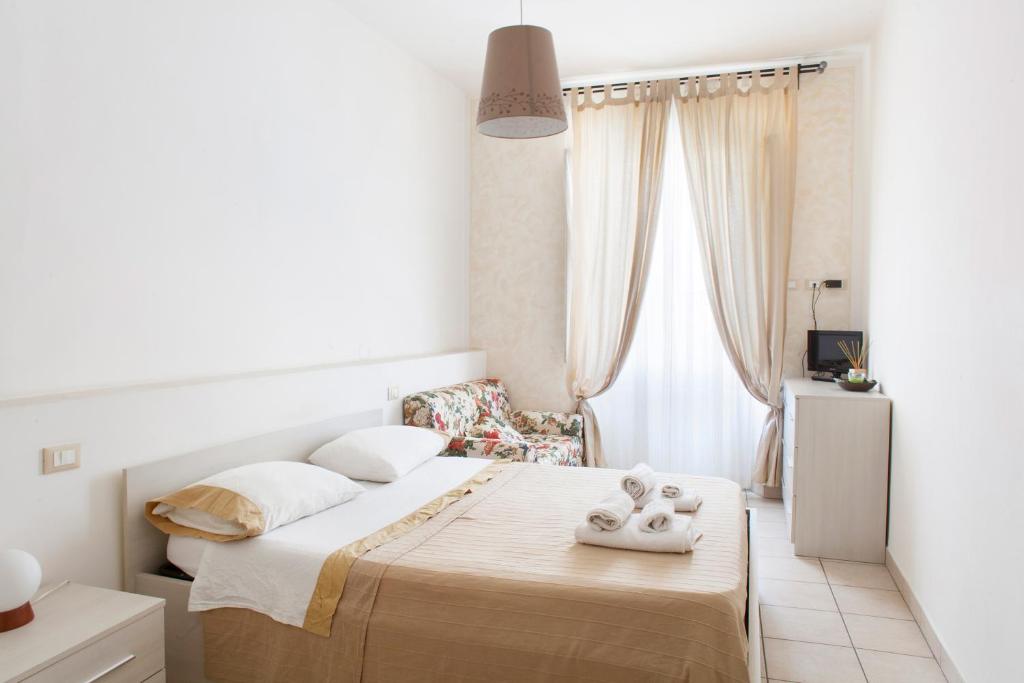 A bed or beds in a room at Affittacamere San Jacopino