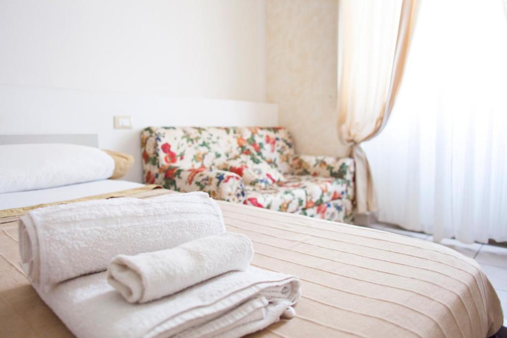 A bed or beds in a room at Affittacamere San Jacopino