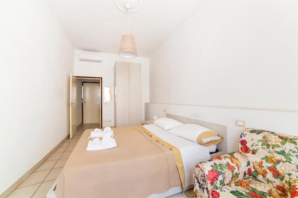 A bed or beds in a room at Affittacamere San Jacopino
