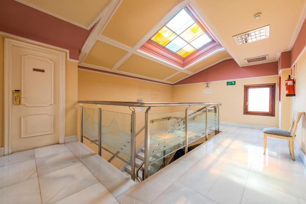 Postel nebo postele na pokoji v ubytování Hospedium Hotel Blu Sondika