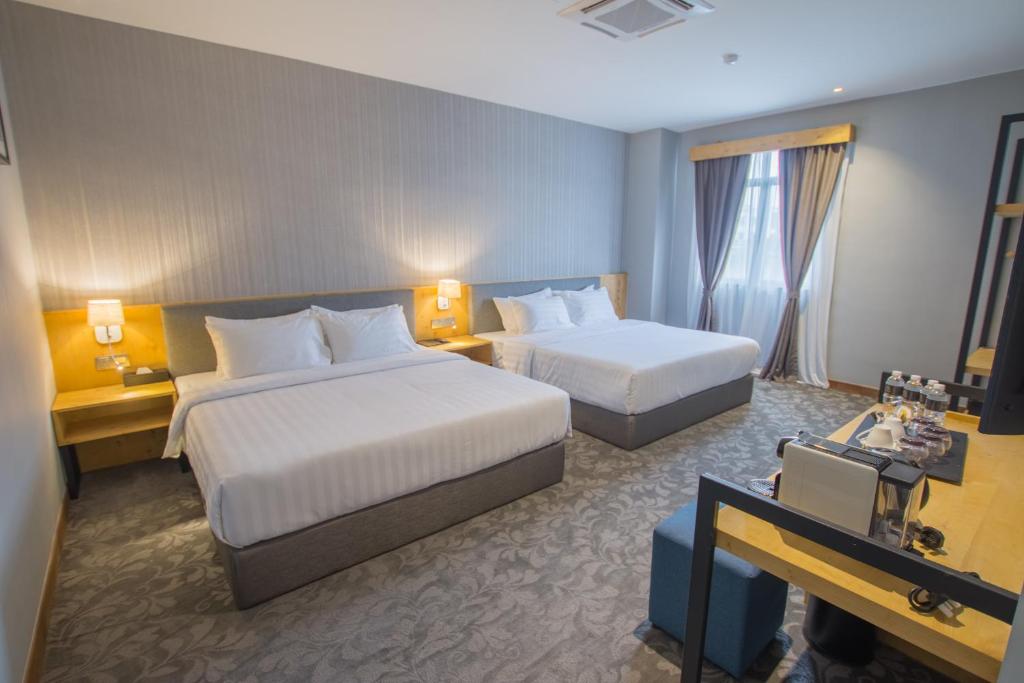 Postel nebo postele na pokoji v ubytování Redpine Boutique Hotel