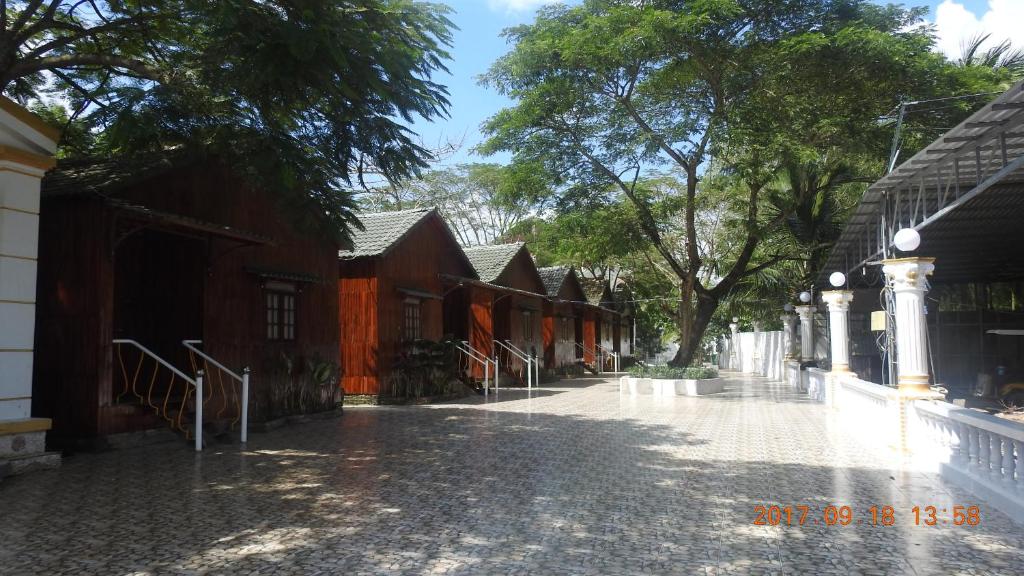 a cobblestone street with a row of houses at Satraco Royal Hotel in Soc Trang