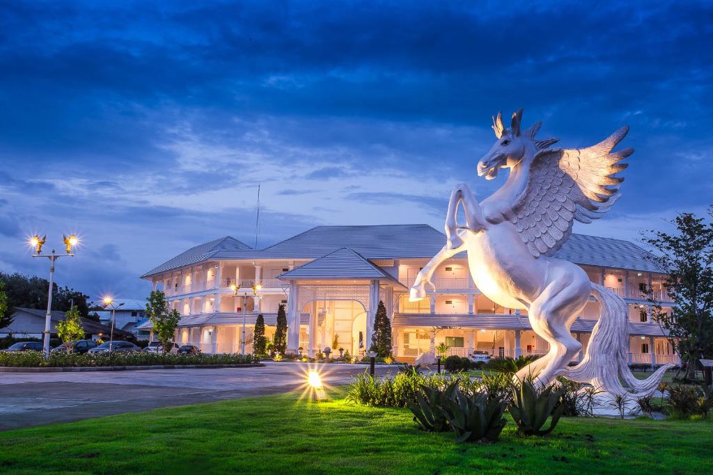 a statue of a unicorn in front of a building at White House in Tak