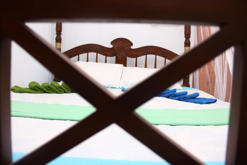 Postel nebo postele na pokoji v ubytování Sun Bird Eco Guest Mirissa